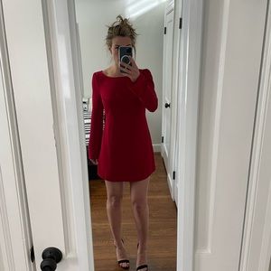 Red GF long sleeve mini- dress with gold button details, open back.